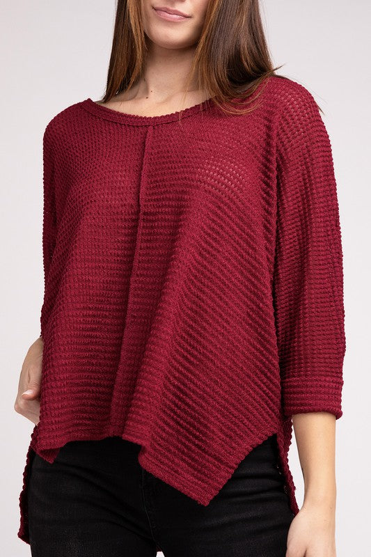 Casual burgundy 3/4 sleeve V-neck hi-low hem jacquard sweater on model, perfect for stylish layering.