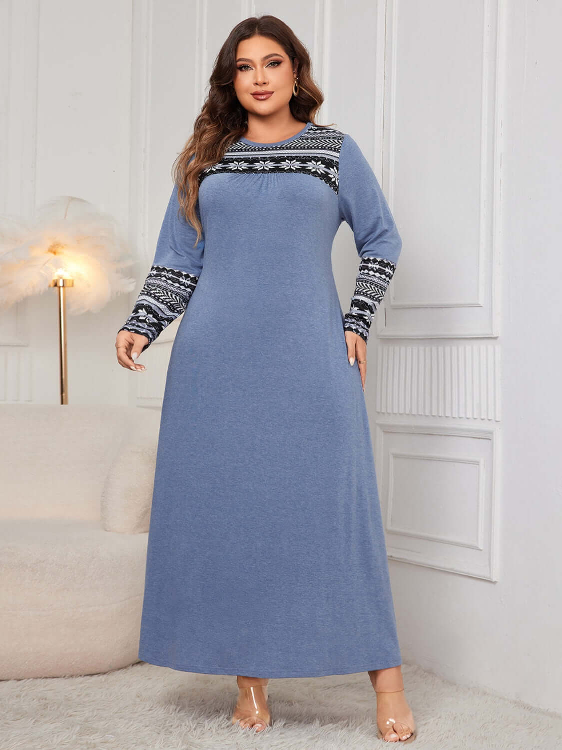 Plus size blue printed round neck long sleeve dress with slightly stretchy fabric and black and white patterned cuffs for a comfortable fit